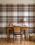 Autumn Lattice Ivory plaid wallpaper behind a vintage writing desk in a cozy craft-room home office