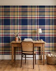 Autumn Lattice Navy plaid wallpaper behind a vintage writing desk in a cozy craft-room home office