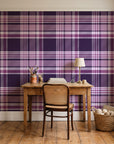 Autumn Lattice Plum plaid wallpaper behind a vintage writing desk in a cozy craft-room home office