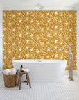Blueprint Bloom Ochre floral line wallpaper behind a freestanding tub in a bright coastal bathroom