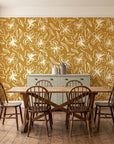Blueprint Bloom Ochre floral line wallpaper in a farmhouse dining room with a sage sideboard and rustic trestle table