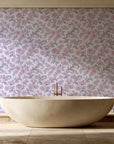 Blush Serenade Aubergine floral damask wallpaper creating ambiance in a serene spa bathroom