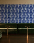 Canyon Ikat Indigo geometric wallpaper in an intimate luxury cocktail lounge
