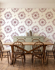 Captain's Wheel Burgundy nautical ship wheel wallpaper in a farmhouse dining room with a sage sideboard and rustic trestle table