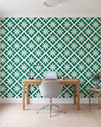 Carbon Bloom Emerald tile floral wallpaper behind a modern oak desk in a bright home office