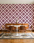 Carbon Bloom Oxblood tile floral wallpaper in a mid-century dining room with a teak sideboard and tulip table
