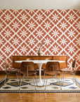 Carbon Bloom Terracotta tile floral wallpaper in a mid-century dining room with a teak sideboard and tulip table
