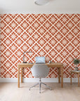 Carbon Bloom Terracotta tile floral wallpaper behind a modern oak desk in a bright home office