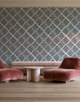 Chevron Etch Ebony geometric diamond wallpaper in a boutique hotel sitting area