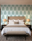 Clipped Dreams Forest tree wallpaper behind the headboard of a king bed in a contemporary hotel guest room
