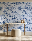 Coastal Village Navy palm toile wallpaper on the wall of a grand entry foyer