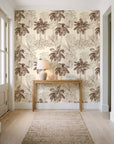 Conservatory Greens Chestnut tropical palm toile wallpaper behind a console table in a light entry hallway