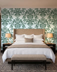Dreamy Fern Dial Sage fern damask wallpaper behind the headboard of a king bed in a contemporary hotel guest room