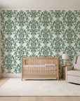 Dreamy Fern Dial Sage fern damask wallpaper in a calm, light-filled nursery