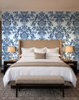 Dreamy Fern Dial Slate fern damask wallpaper behind the headboard of a king bed in a contemporary hotel guest room
