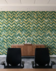 Dusk Passage Emerald chevron wallpaper above a walnut credenza in a modern conference room