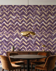 Dusk Passage Plum chevron wallpaper behind a walnut credenza and round table in an elegant dining room