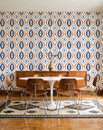 Ember & Iron Navy retro ogee wallpaper in a mid-century dining room with a teak sideboard and tulip table