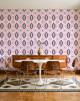 Ember & Iron Plum retro ogee wallpaper in a mid-century dining room with a teak sideboard and tulip table
