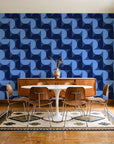 Ember Mosaic Midnight retro geometric wallpaper in a mid-century dining room with a teak sideboard and tulip table