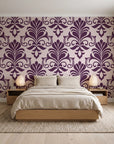 Ethereal Flowers Aubergine damask wallpaper behind a low platform bed in a serene Japandi bedroom