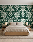 Ethereal Flowers Emerald damask wallpaper behind a low platform bed in a serene Japandi bedroom