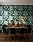 Ethereal Flowers Emerald damask wallpaper in a dark moody dining room with a candlelit table
