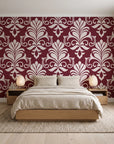 Ethereal Flowers Garnet damask wallpaper behind a low platform bed in a serene Japandi bedroom