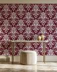 Ethereal Flowers Garnet damask wallpaper on the wall of a grand entry foyer