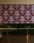 Ethereal Flowers Garnet damask wallpaper in an intimate luxury cocktail lounge