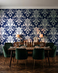 Ethereal Flowers Midnight damask wallpaper in a dark moody dining room with a candlelit table