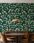 Evening Garden Forest botanical floral wallpaper behind a walnut credenza and round table in an elegant dining room