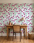 Evening Garden Linen botanical floral wallpaper behind a vintage writing desk in a cozy craft-room home office