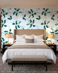 Falling Softly Emerald botanical leaf wallpaper behind the headboard of a king bed in a contemporary hotel guest room