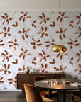 Falling Softly Terracotta botanical leaf wallpaper in an elegant dining room