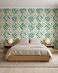 Fern Lattice Emerald hand-drawn diamond wallpaper behind a low platform bed in a serene Japandi bedroom
