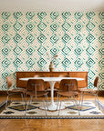 Fern Lattice Emerald hand-drawn diamond wallpaper in a mid-century dining room with a teak sideboard and tulip table