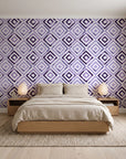 Fern Lattice Plum hand-drawn diamond wallpaper behind a low platform bed in a serene Japandi bedroom