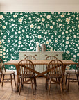 First Bloom Emerald ditsy floral wallpaper in a farmhouse dining room with a sage sideboard and rustic trestle table