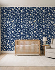 First Bloom Navy ditsy floral wallpaper in a calm, light-filled nursery