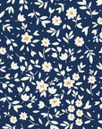 First Bloom Navy ditsy floral wallpaper in navy and cream