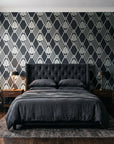 Floral Fantasia Charcoal diamond lattice wallpaper behind a tufted headboard in a dark, moody bedroom