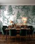 Frost & Fable Forest woodland toile wallpaper in a dark moody dining room with a candlelit table