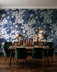 Frost Garden Veil Slate floral wallpaper in a dark moody dining room with a candlelit table