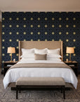 Frost Mosaic Noir geometric tile wallpaper behind the headboard of a king bed in a contemporary hotel guest room
