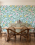 Garden Reverie Emerald floral wallpaper in a farmhouse dining room with a sage sideboard and rustic trestle table