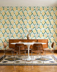 Gilded Crossing Emerald chevron geometric wallpaper in a mid-century dining room with a teak sideboard and tulip table