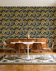 Gilded Crossing Onyx chevron geometric wallpaper in a mid-century dining room with a teak sideboard and tulip table
