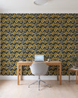 Gilded Crossing Onyx chevron geometric wallpaper behind a modern oak desk in a bright home office