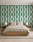 Gilded Rain Emerald geometric wallpaper behind a low platform bed in a serene Japandi bedroom